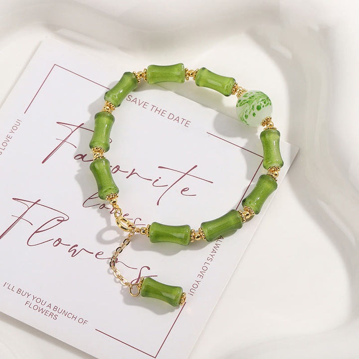 Bracciale a catena della ricchezza in agata muschiata con motivo in bambù verde Buddha Stones Liuli