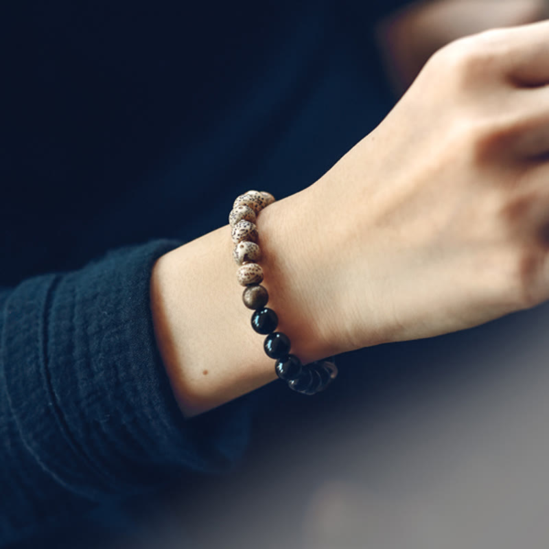 Buddha Stones Semi di Bodhi Tibetano Ossidiana Nera Legno di Ebano Rame Braccialetto della Pace