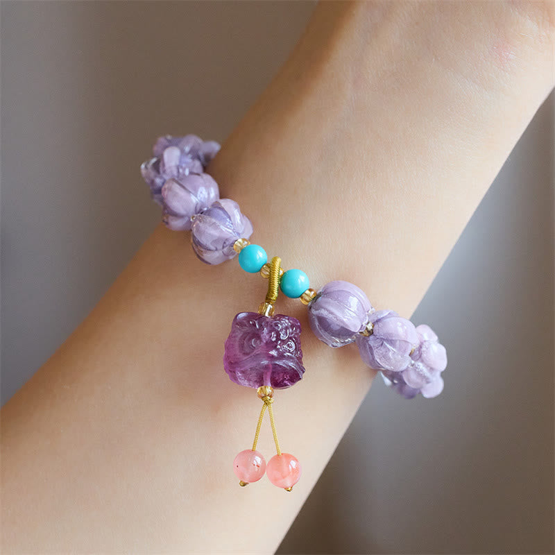 Braccialetto dell'illuminazione con ciondolo leone danzante avorio, perline di vetro Liuli, motivo loto, fluorite e Buddha Stones
