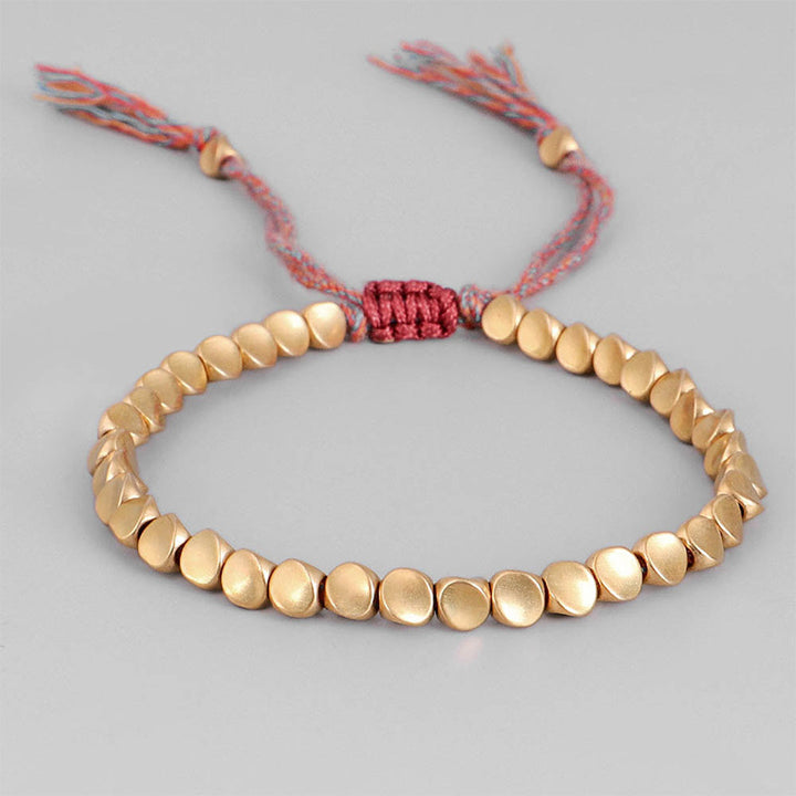 Braccialetto portafortuna con perline di rame tibetano Buddha Stones