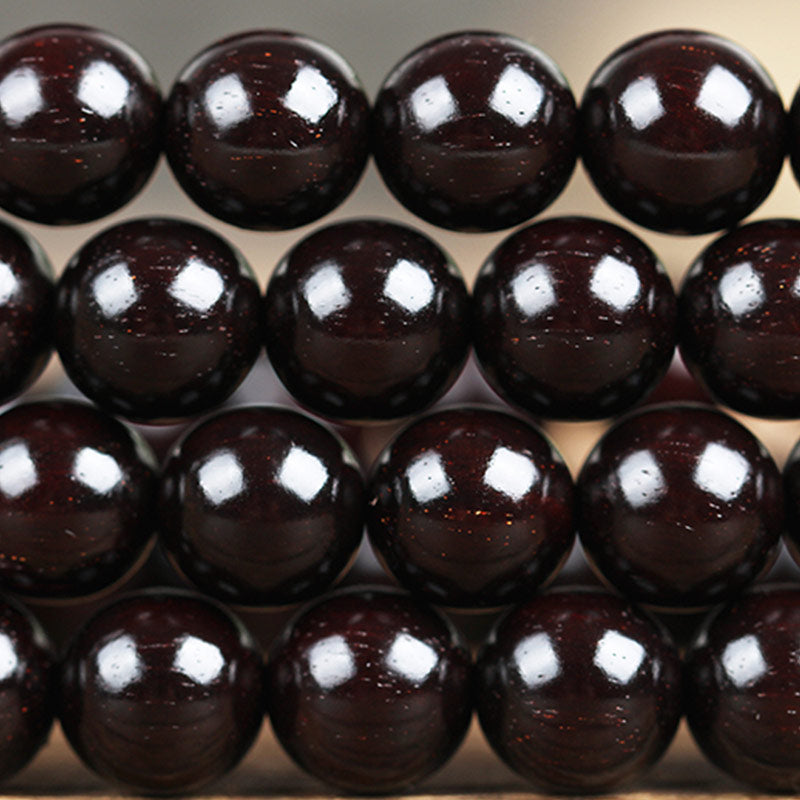 Braccialetto di protezione con nodo cinese in legno di sandalo rosso con piccola foglia e stella d'oro Buddha Stones