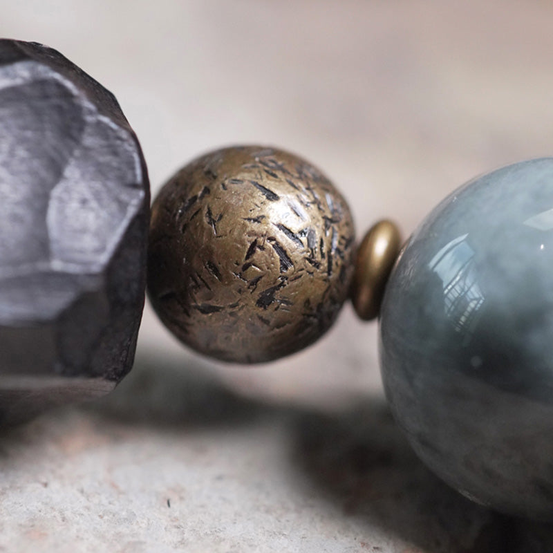 Braccialetto di coppia di fiducia in pietra occhio d'aquila in legno di ebano e Buddha Stones