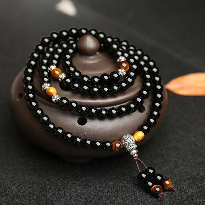 Bracciale Mala di benedizione con occhio di tigre e ossidiana nera Buddha Stones