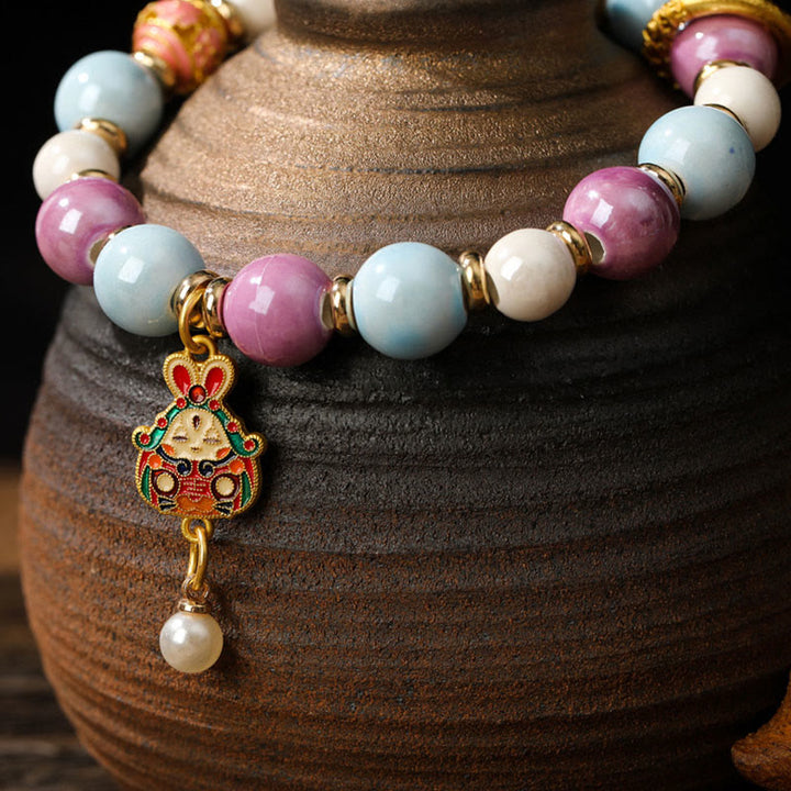 Buddha Stones Tibetano Zakiram Dea della Ricchezza Coniglio Testa di Leone Ciondolo Liuli Vetro Incenso Cenere Perline di Porcellana Braccialetto di Protezione
