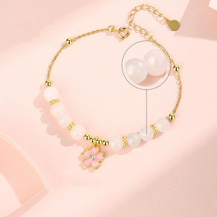 Braccialetto di protezione in giada bianca Hetian con fiori di ciliegio in argento sterling 925 Buddha Stones