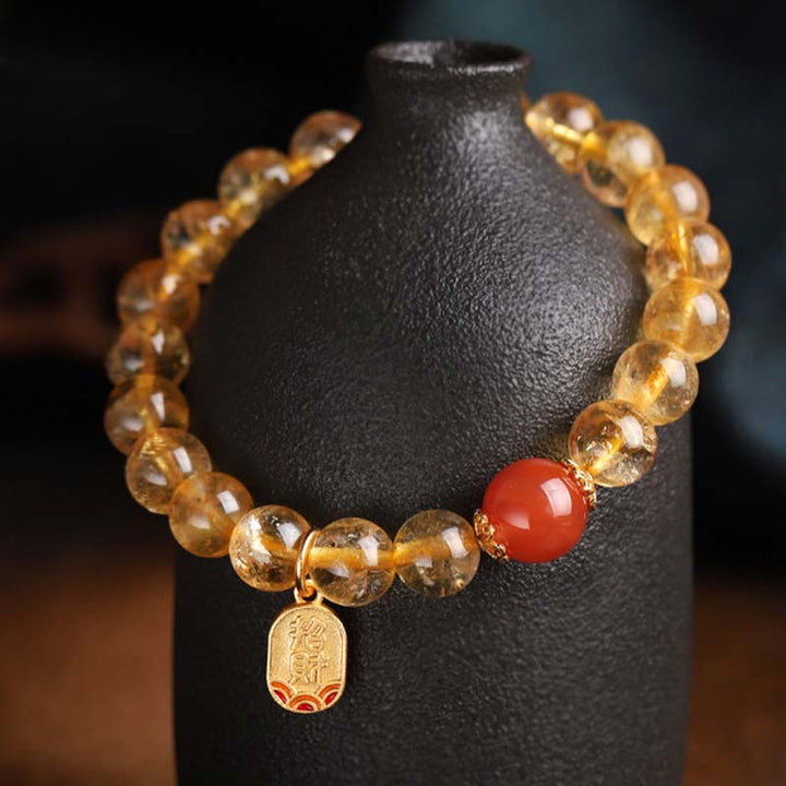 Braccialetto con ciondolo della fortuna in agata rossa e citrino Buddha Stones