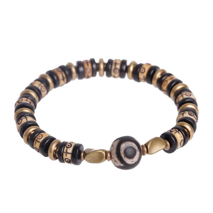 Braccialetto di forza in perline di osso tibetano e legno di ebano con Buddha Stones