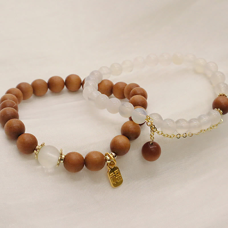 Braccialetto di protezione con ciondolo a forma di carattere Fu con occhio di gatto Buddha Stones in legno di sandalo