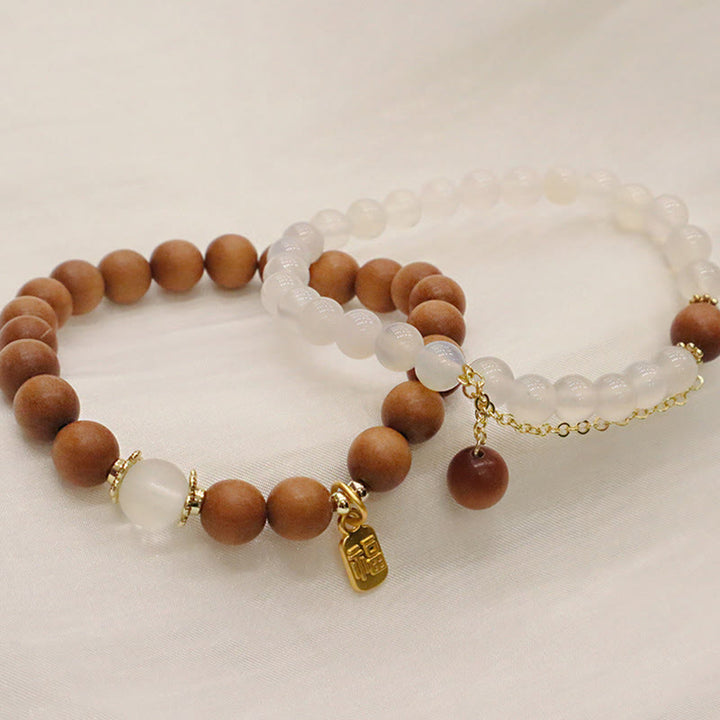 Braccialetto di protezione con ciondolo a forma di carattere Fu con occhio di gatto Buddha Stones in legno di sandalo