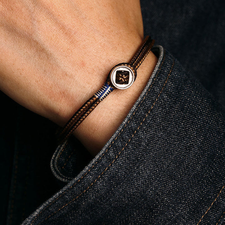 Braccialetto con cordino intrecciato di protezione con bottone fatto a mano in argento sterling 925 Buddha Stones