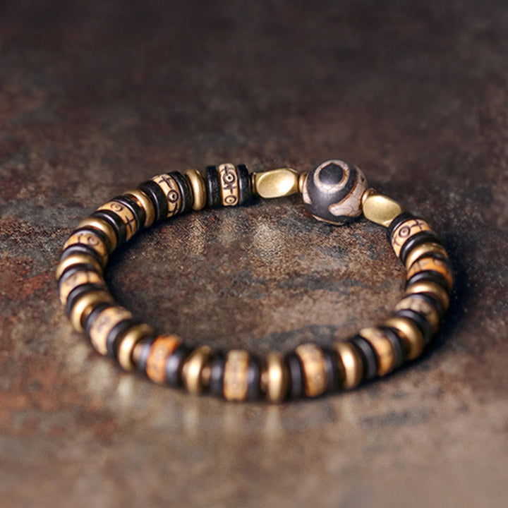 Braccialetto di forza in perline di osso tibetano e legno di ebano con Buddha Stones