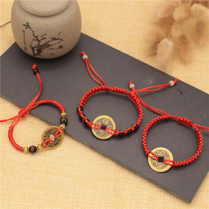 Braccialetto intrecciato con corda rossa, moneta di rame e Buddha Stones