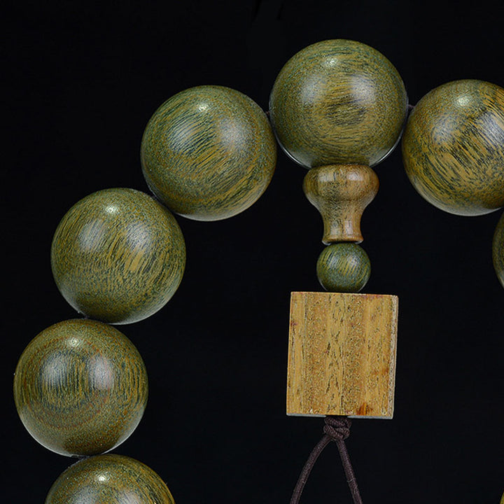 Braccialetto di cura in legno di sandalo verde tibetano Buddha Stones
