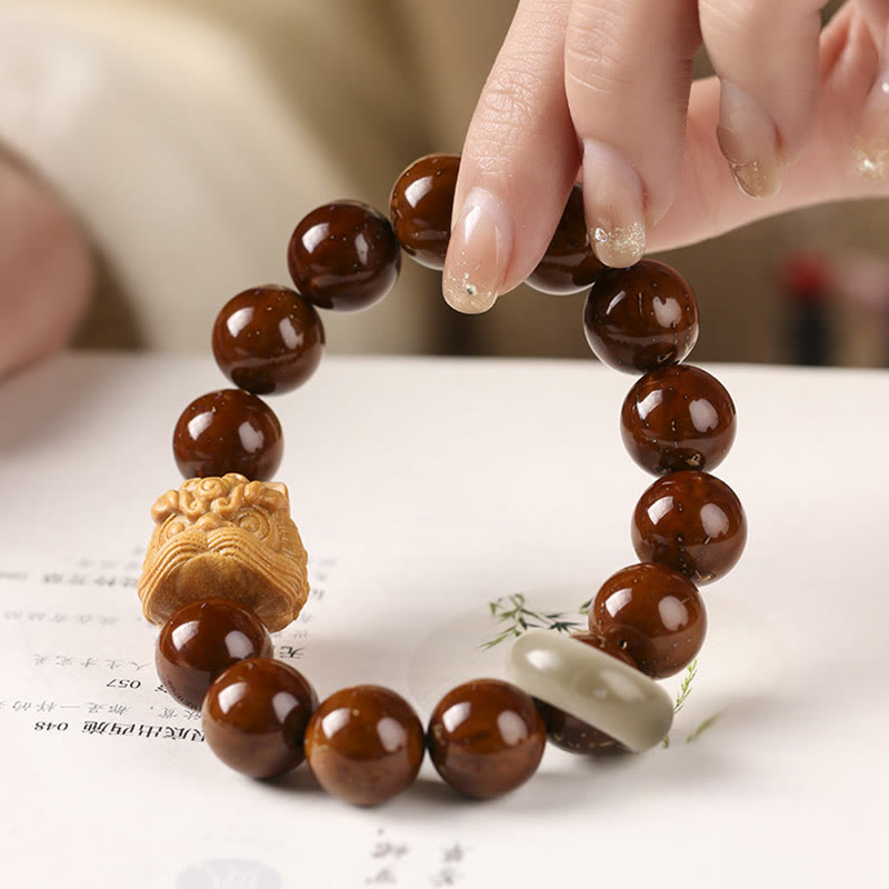 Braccialetto della saggezza del leone danzante dei semi di Bodhi viola Buddha Stones