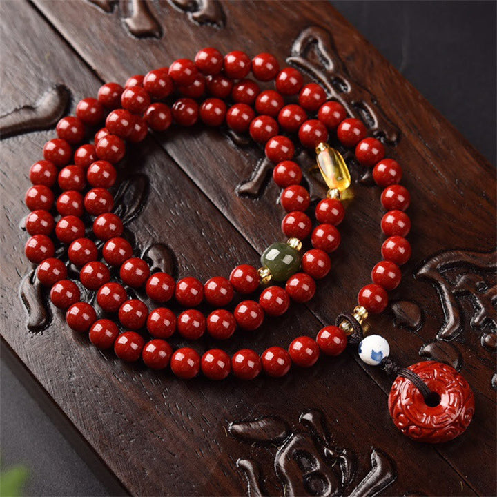 Braccialetto di benedizione a triplo giro con fibbia della pace in cinabro tibetano Buddha Stones Mala
