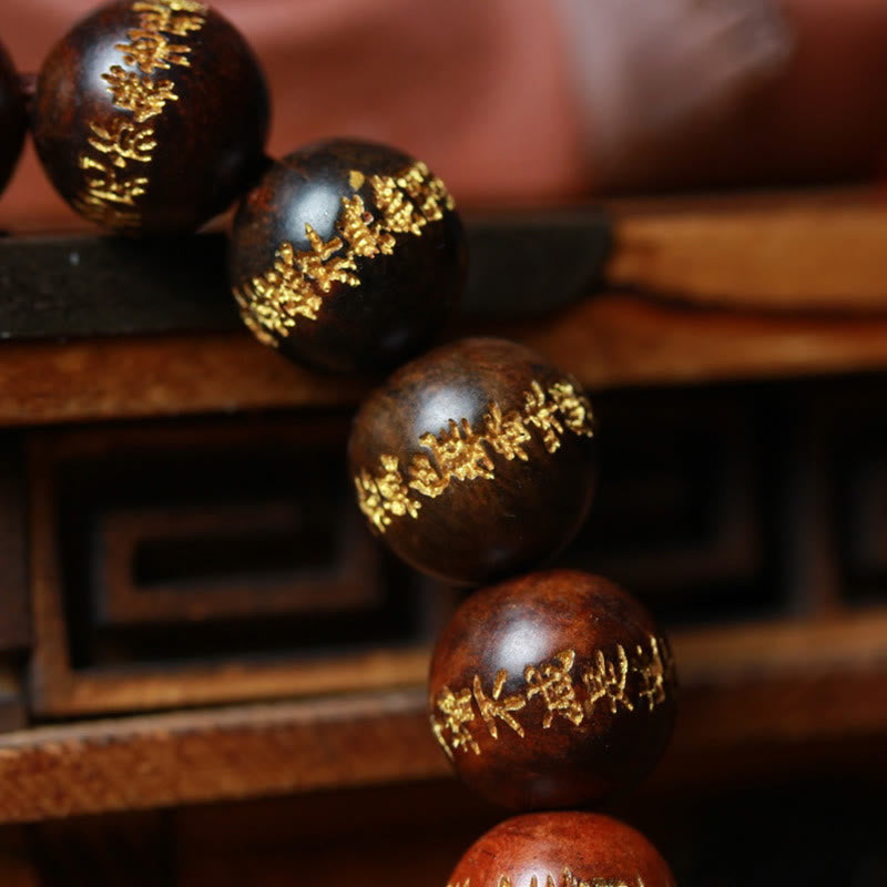 Braccialetto di guarigione inciso con il Sutra del cuore in palissandro tibetano