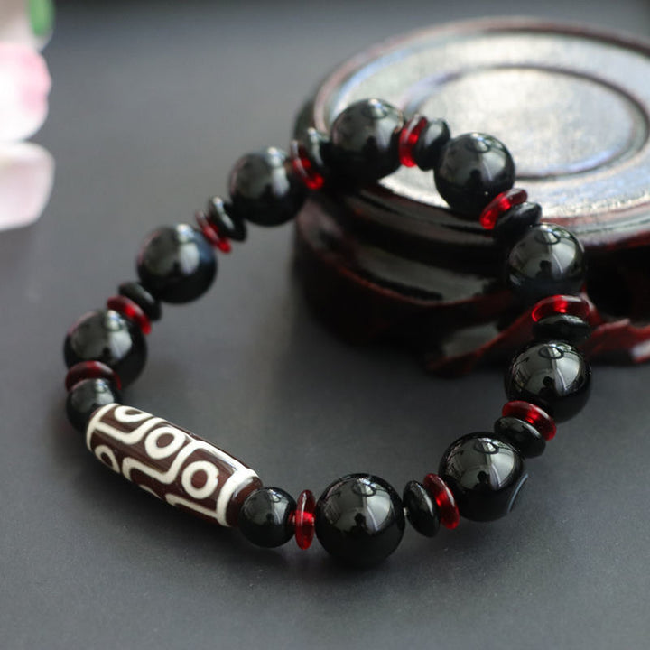 Braccialetto di protezione della ricchezza con perline Dzi a nove occhi in onice nero Buddha Stones