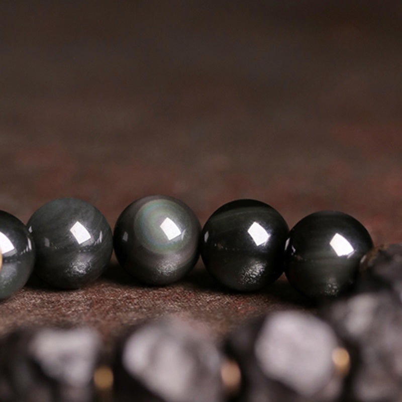 Braccialetto di coppia forza in rame, legno di ebano e ossidiana nera Buddha Stones