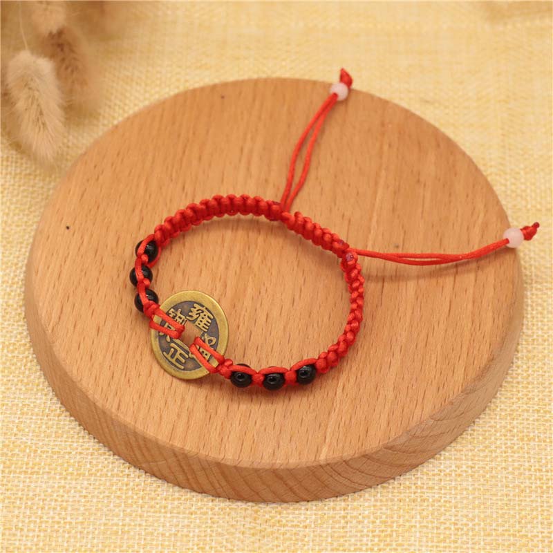 Braccialetto intrecciato con corda rossa, moneta di rame e Buddha Stones