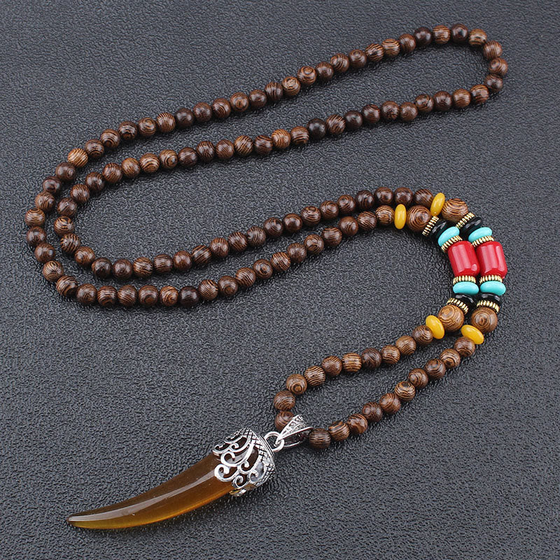 Collana con ciondolo in stile corno in pietra turchese e legno wenge, protezione e meditazione