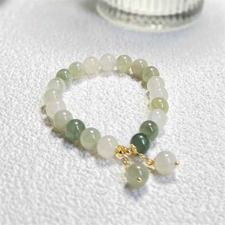 Braccialetto con ciondolo a forma di perlina di fortuna con abbondanza di giada sfumata naturale Buddha Stones