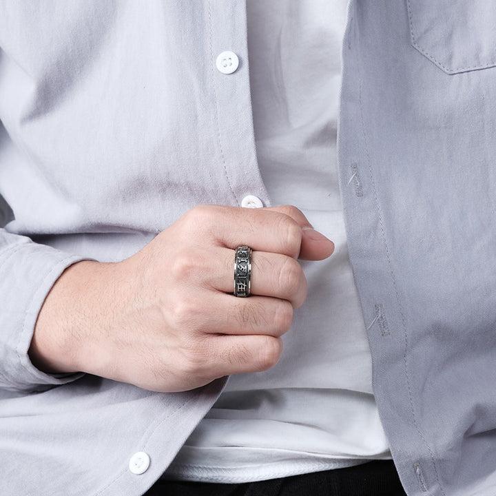 Anello girevole in acciaio al titanio con parole in equilibrio e calma