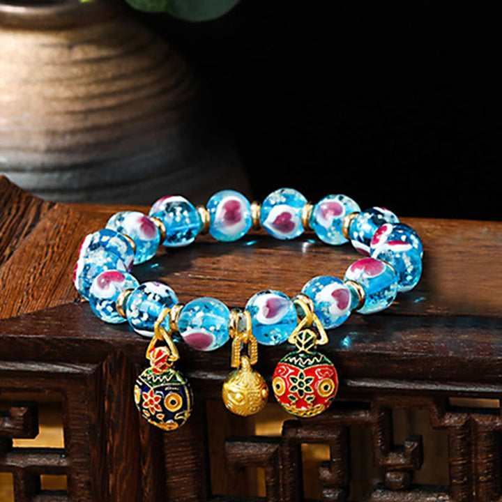 Braccialetto di perline di vetro fluorescente luminoso Liuli con cuore rosa della famiglia di bestie che ingoiano Buddha Stones