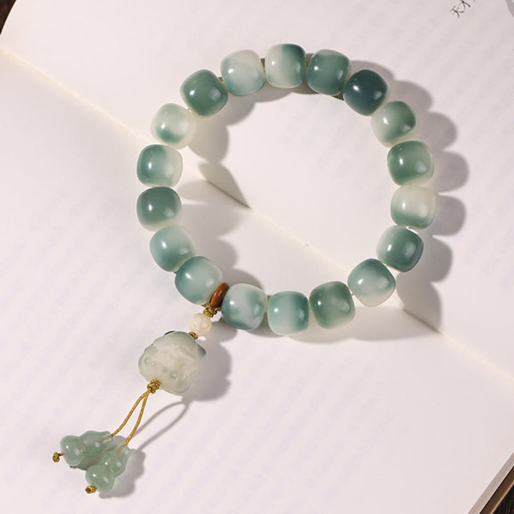Bracciale della pace Buddha Stones, semi di Bodhi sfumati, volpe a nove code, zampa di gatto, artiglio di pigna - image 6