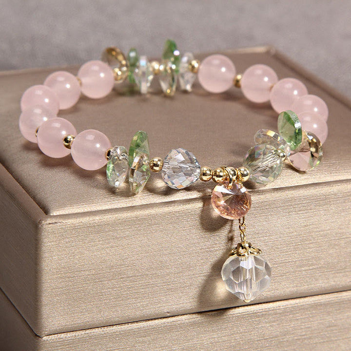 Braccialetto con ciondolo di pace in cristallo rosa con occhio di gatto Buddha Stones
