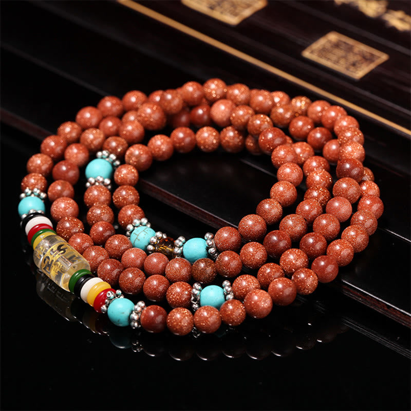 Buddha Stones 108 Mala Beads Goldstone Om Mani Padme Hum Swastika Braccialetto di Fiducia