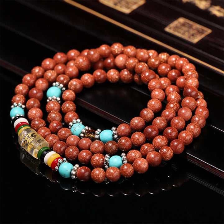 Buddha Stones 108 Mala Beads Goldstone Om Mani Padme Hum Swastika Braccialetto di Fiducia