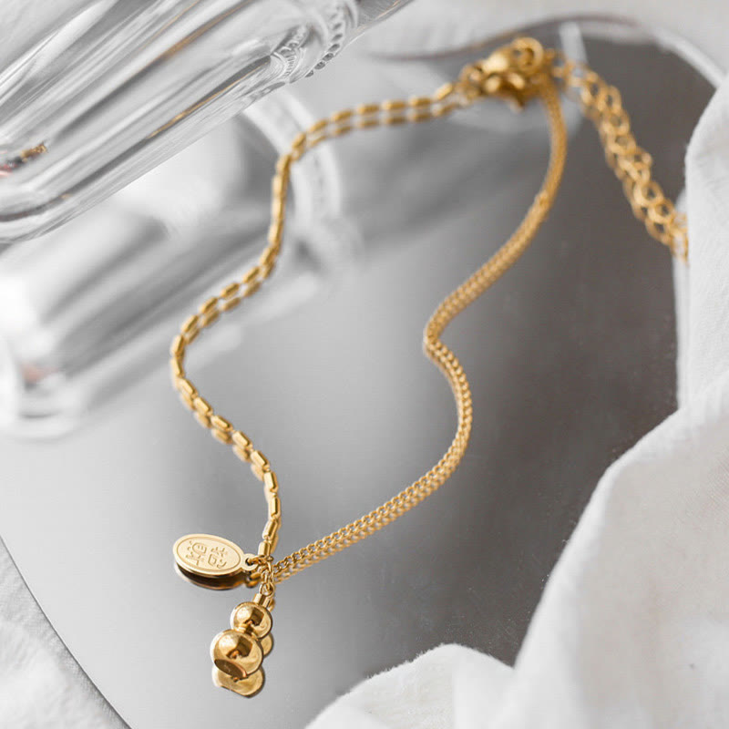 Cavigliera con fibbia della ricchezza e design a zucca portafortuna in oro 18k Buddha Stones