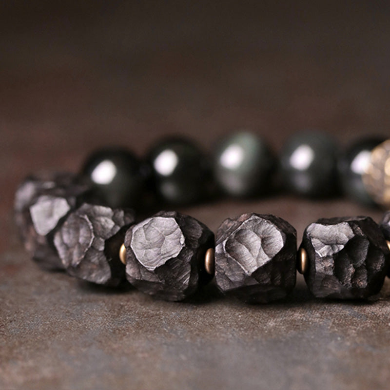 Braccialetto di coppia forza in rame, legno di ebano e ossidiana nera Buddha Stones