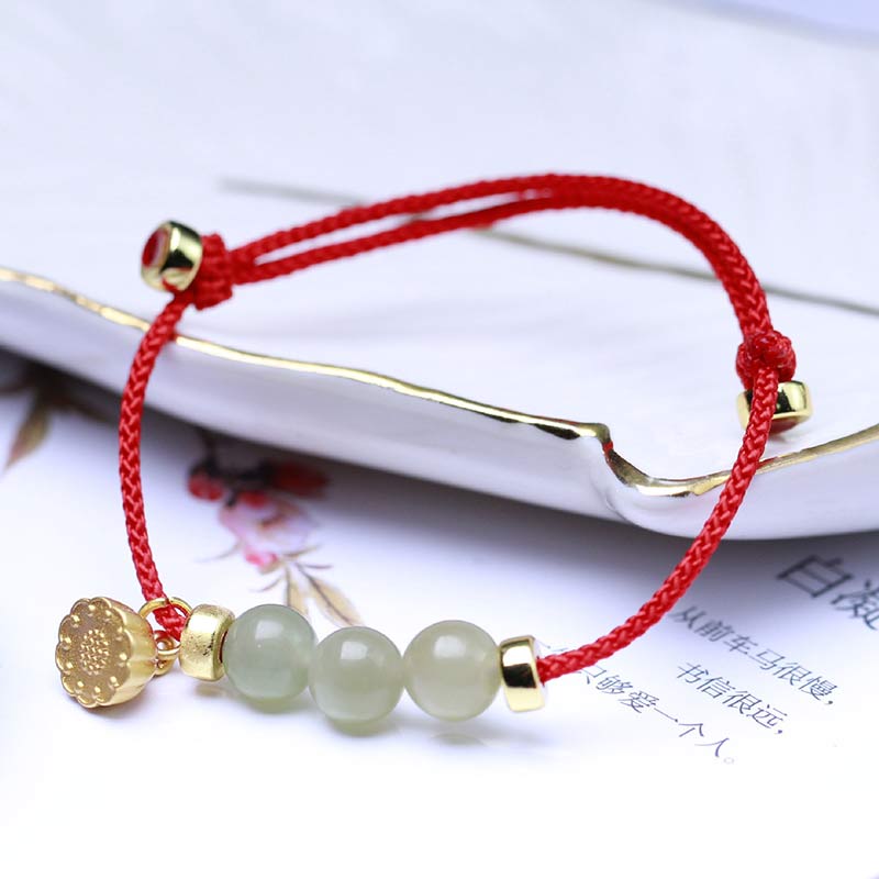 Braccialetto intrecciato con corda rossa in semi di loto di giada naturale Buddha Stones