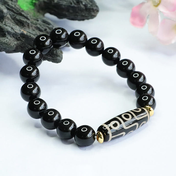 Braccialetto di potere in onice nero con perline Dzi tibetane a nove occhi Buddha Stones