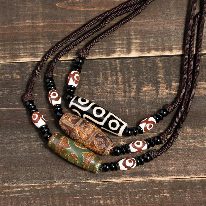 Buddha Stones Collana di perline tibetane Dzi a nove occhi con cordino protettivo - image 0
