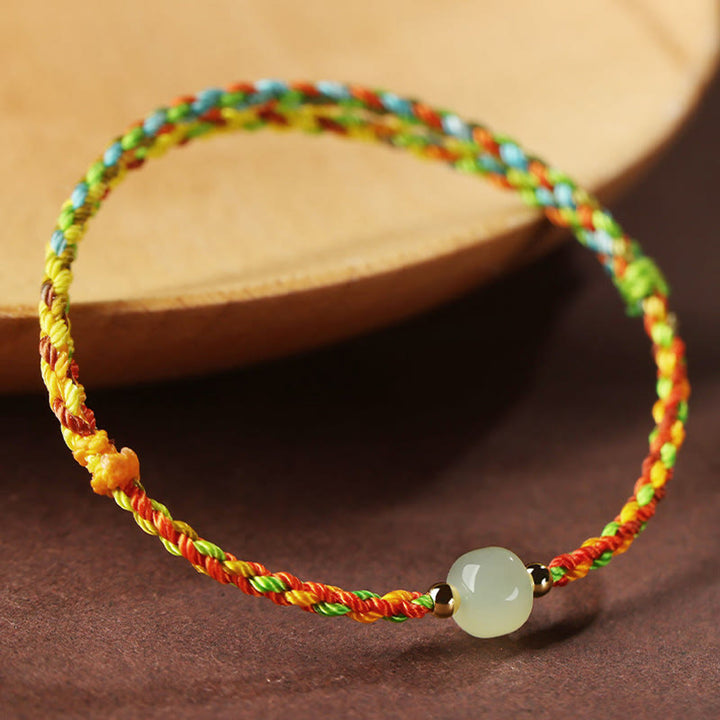 Braccialetto di abbondanza di perline di giada con corda colorata Buddha Stones Luck