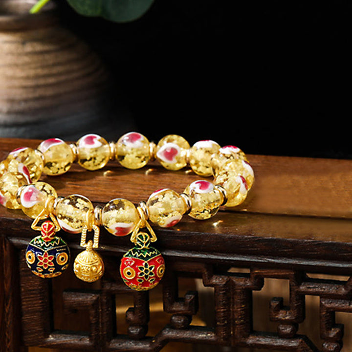 Braccialetto di perline di vetro fluorescente luminoso Liuli con cuore rosa della famiglia di bestie che ingoiano Buddha Stones