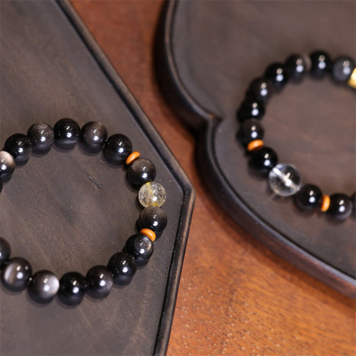 Braccialetto di protezione con perline di cristallo di ossidiana lucida in argento naturale Buddha Stones Om Mani Padme Hum