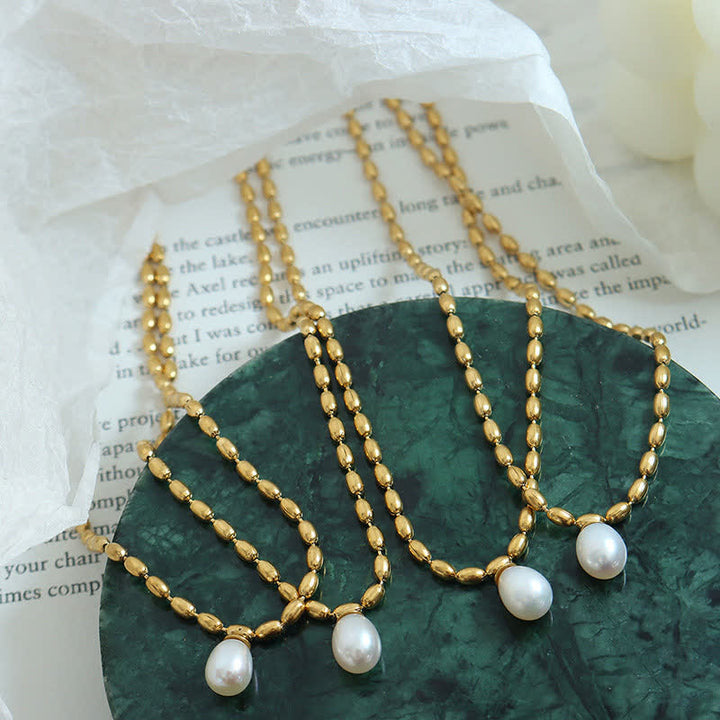 Collana con ciondolo di perle e perle della pace