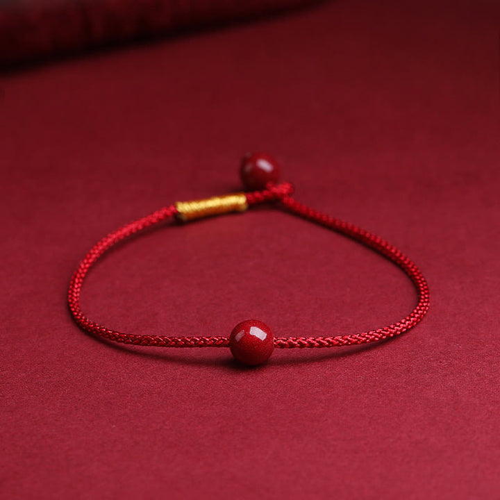 Braccialetto di corda rossa con benedizione in agata rossa naturale e cinabro Buddha Stones