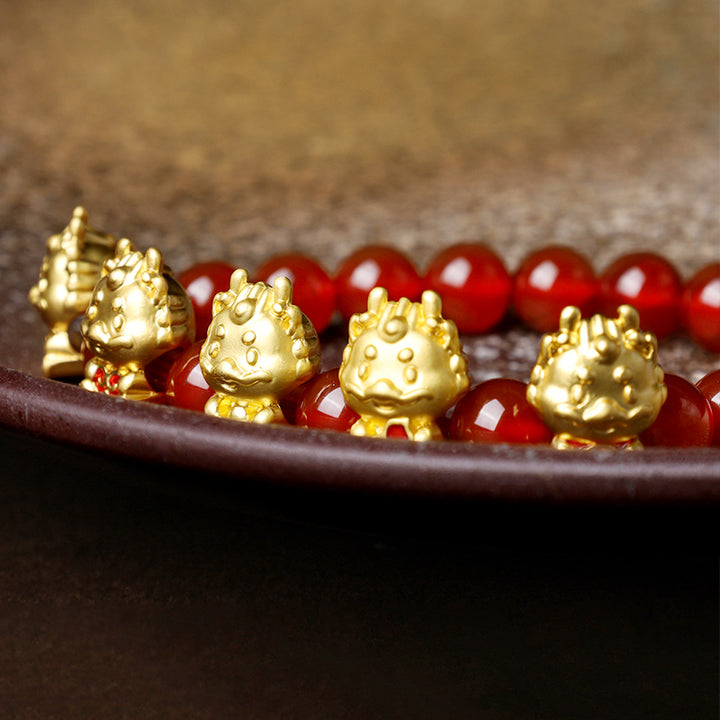 Braccialetto di protezione del carattere Fu della moneta di rame naturale di agata rossa dell'anno del drago Buddha Stones
