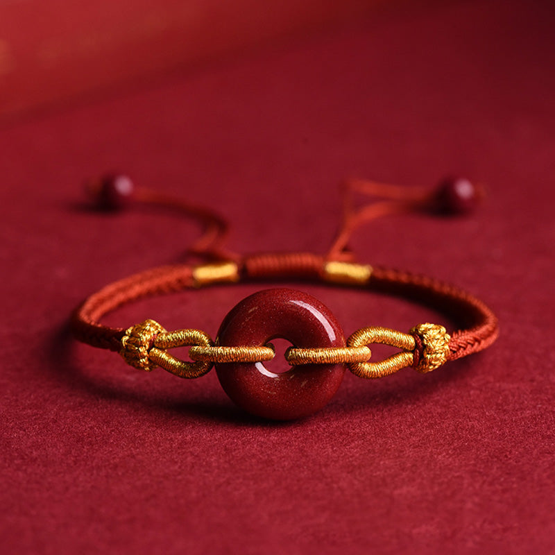 Bracciale intrecciato con motivo a fibbia per la pace in cinabro lavorato a mano Buddha Stones