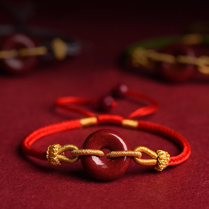 Bracciale intrecciato con motivo a fibbia per la pace in cinabro lavorato a mano Buddha Stones