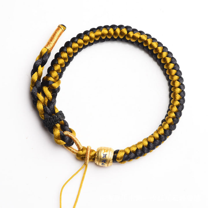 Braccialetto di purezza Om Mani Padme Hum in corda di scaglie di drago in oro nero tibetano fatto a mano con Buddha Stones