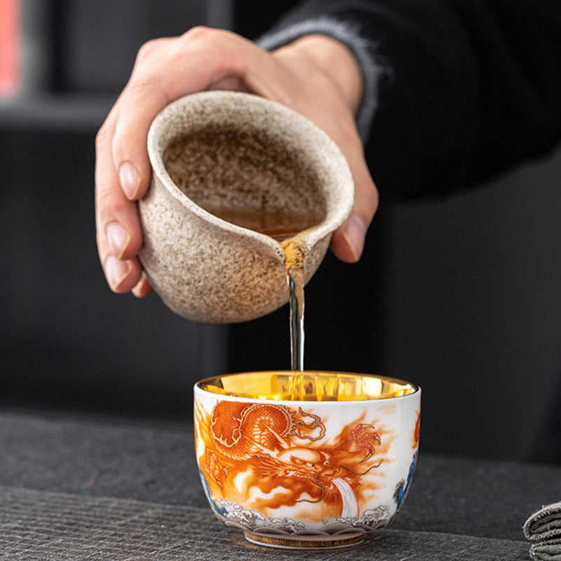 Buddha Stones Drago Fenice Gru Sole Oceano Onde Tazza da tè in ceramica dorata Tazza da tè Kung Fu 170ml