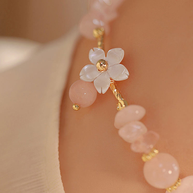 Bracciale Buddha Stones placcato oro 14k con fiore di cristallo rosa naturale