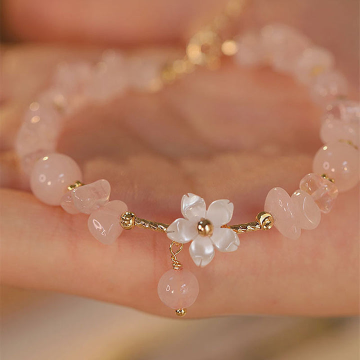 Bracciale Buddha Stones placcato oro 14k con fiore di cristallo rosa naturale
