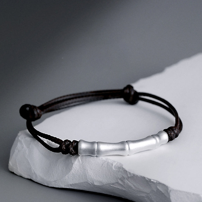 Braccialetto intrecciato con corda portafortuna a motivo osseo in argento sterling 999 Buddha Stones