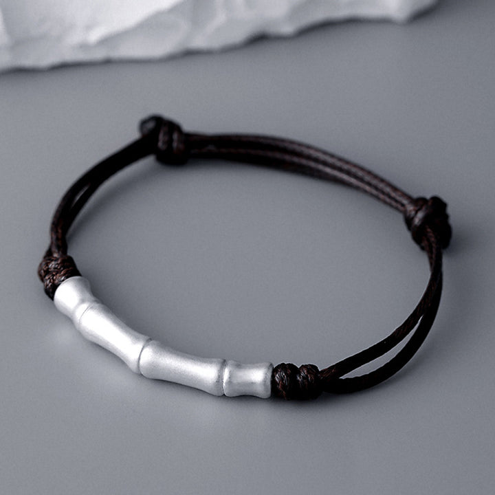 Braccialetto intrecciato con corda portafortuna a motivo osseo in argento sterling 999 Buddha Stones